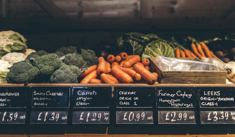 Fresh brocolli and carrots placed on the vegetable stall inside Farmer Copleys Farm Shop in West Yorkshire.